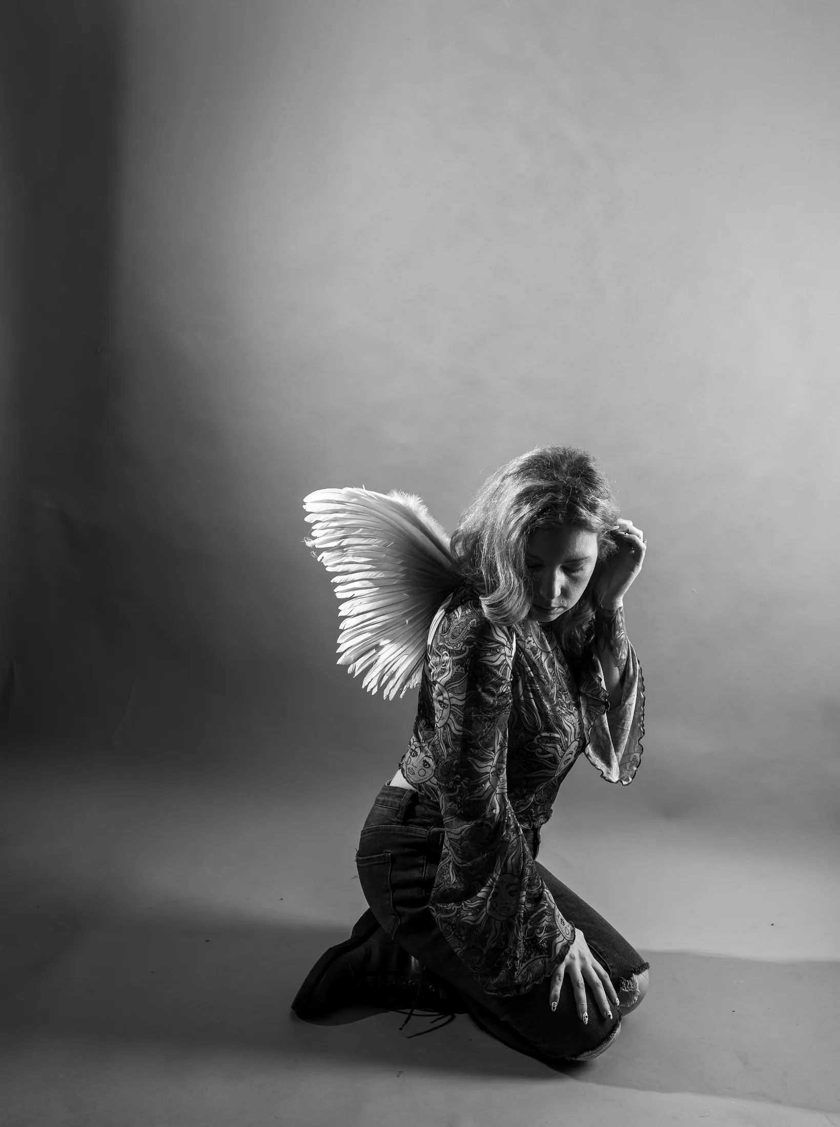 Second black-and-white angel-inspired portrait in sculpted light