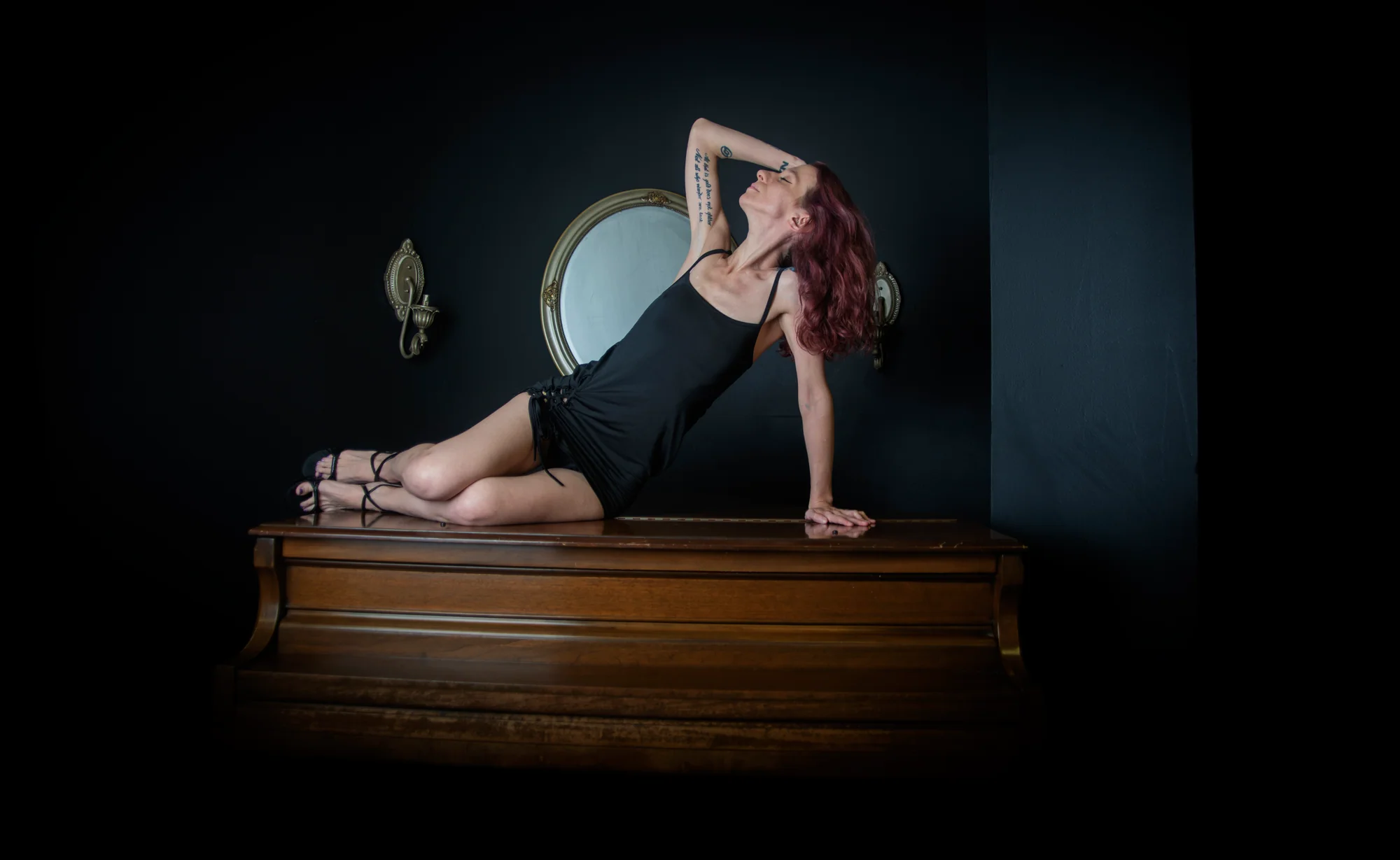 Tasteful boudoir portrait with dramatic studio light