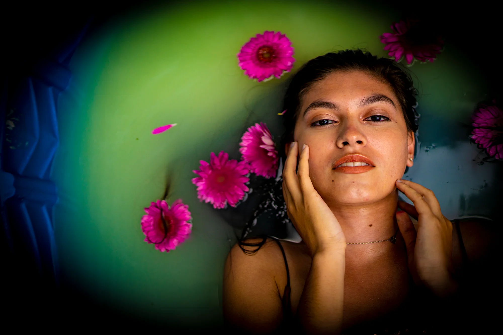 Dreamlike creative portrait surrounded by floating flowers