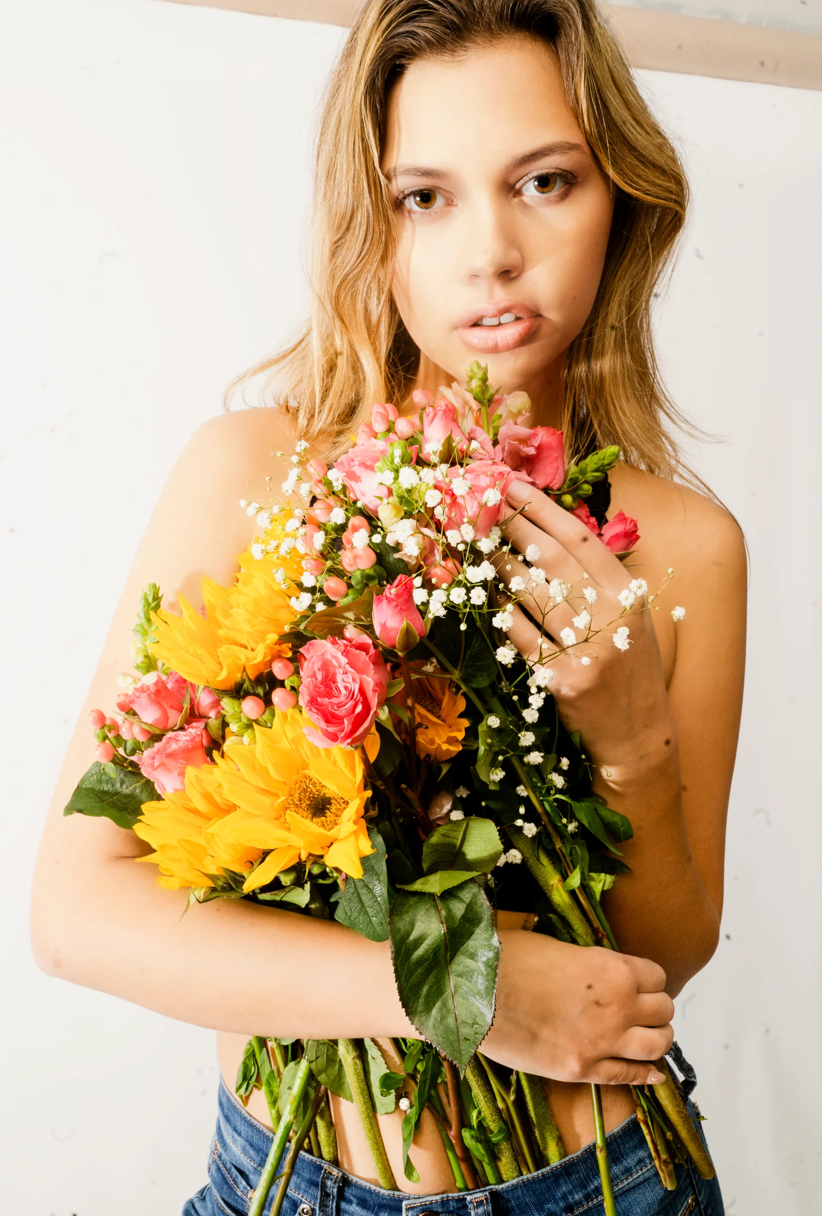 Portrait subject holding an expressive bouquet