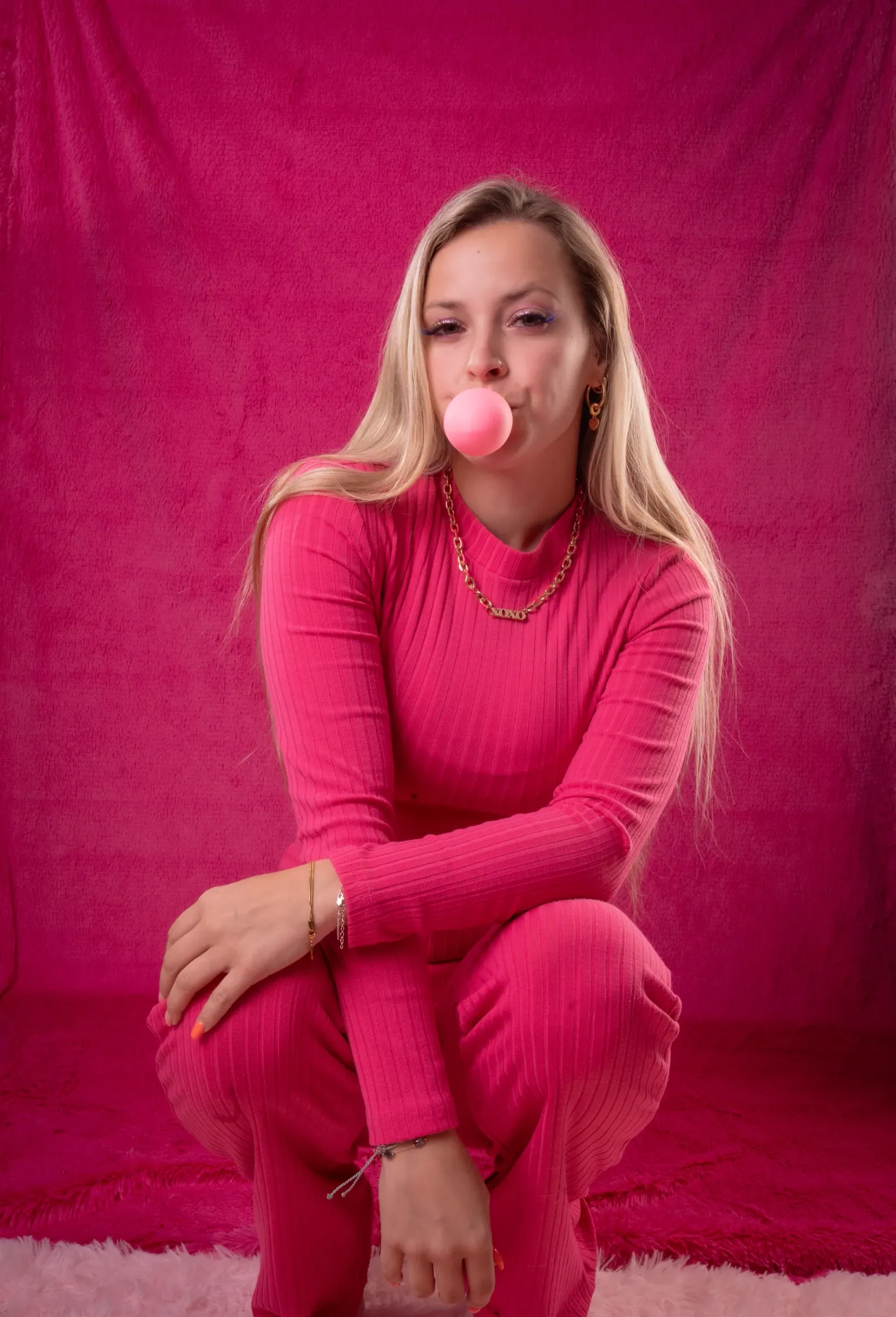 Second playful fashion portrait in a bubblegum-pink set
