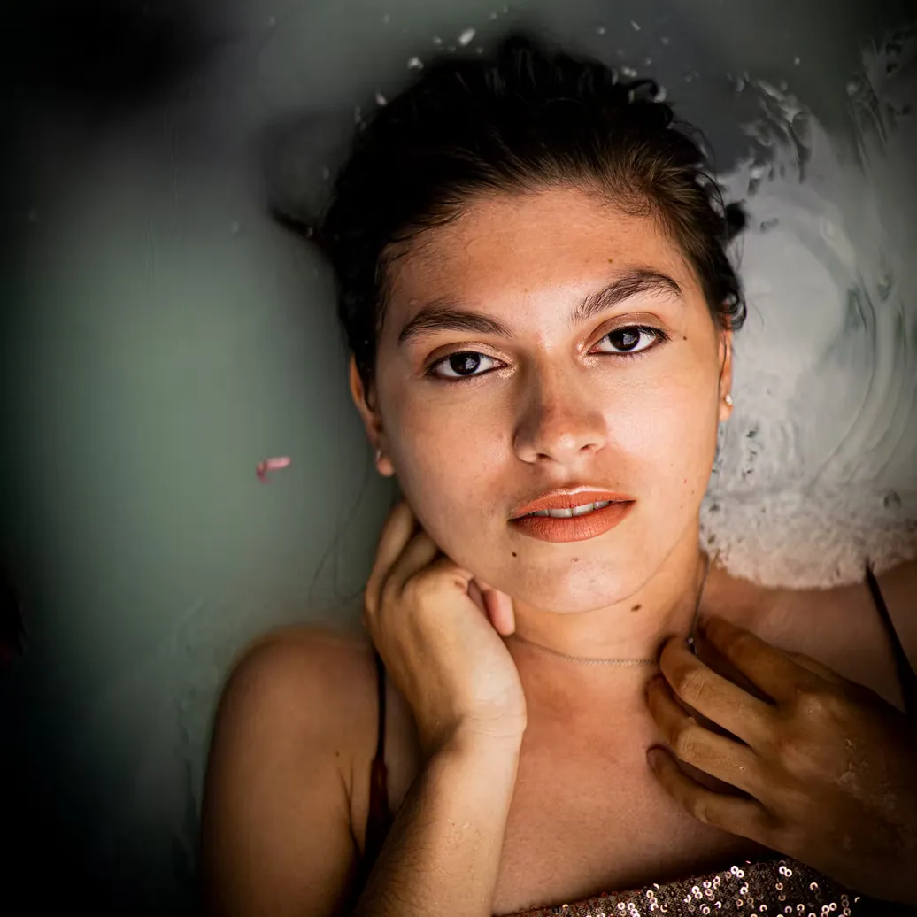Close, thoughtful portrait in soft studio light